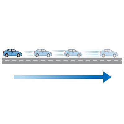 A car speeds up as it moves along a road.