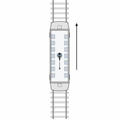 Train moving upward while a person inside walks downward.